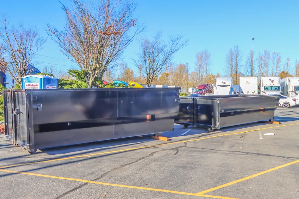 Professional dumpster rental service with roll-off container on residential driveway in Winthrop Harbor